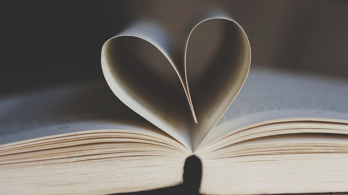 A library book with two pages folded in the shape of a heart.