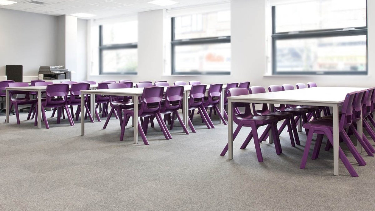 Empty Classroom with Purple Desk